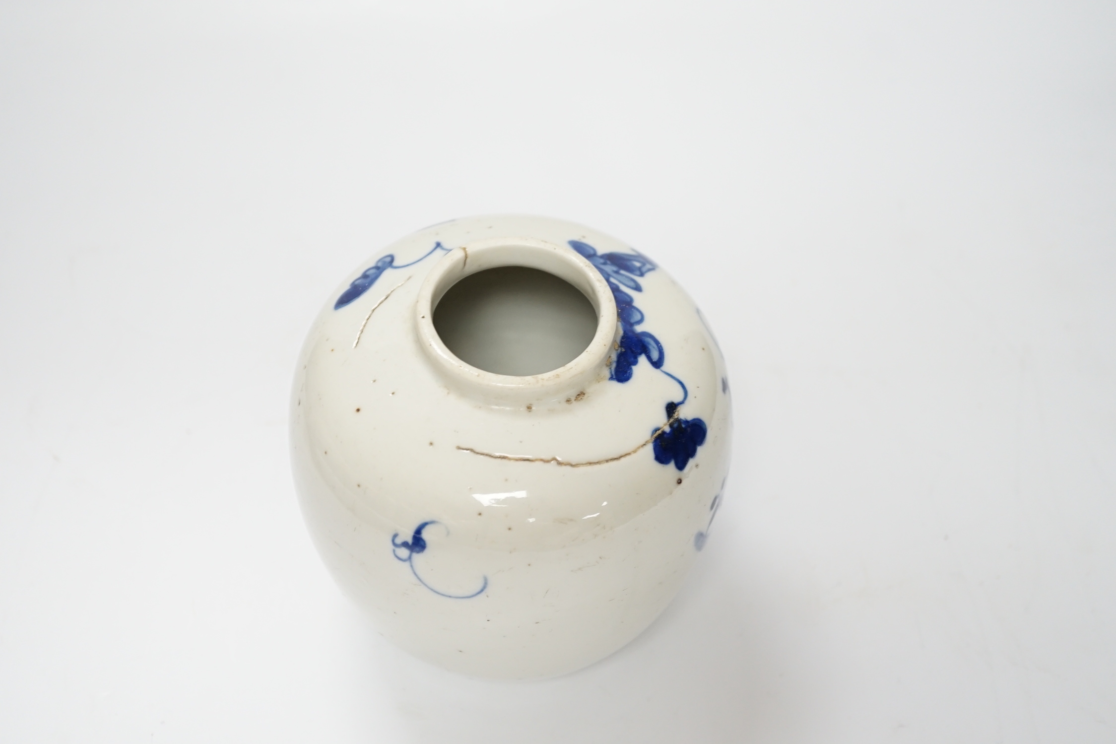 A Chinese blue and white jar, 19th century, with pierced hardwood lid, 15cm high